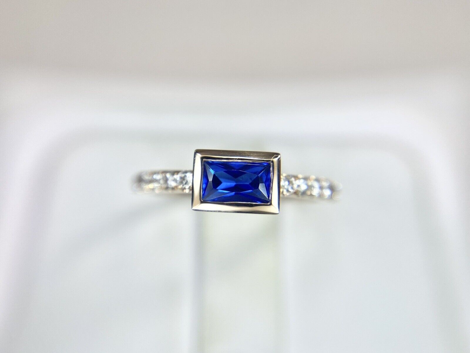 14k Rose Gold Emerald Cut Blue Sapphire Round Diamond Bezel Set Ring